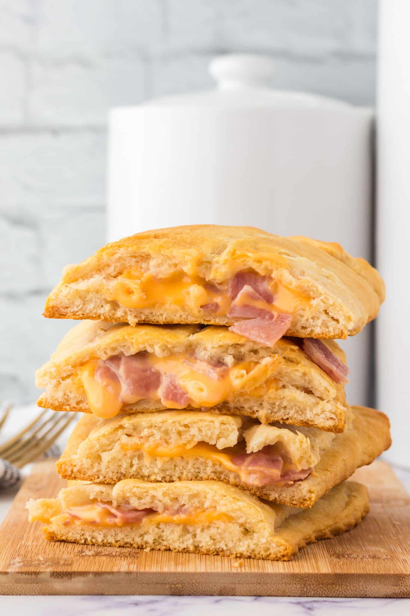 Ham and Cheese Hot Pockets are a kid friendly lunch or dinner recipe using Pillsbury crescent rolls, American cheese slices and chopped ham slices.