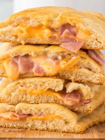 Ham and Cheese Hot Pockets are a kid friendly lunch or dinner recipe using Pillsbury crescent rolls, American cheese slices and chopped ham slices.