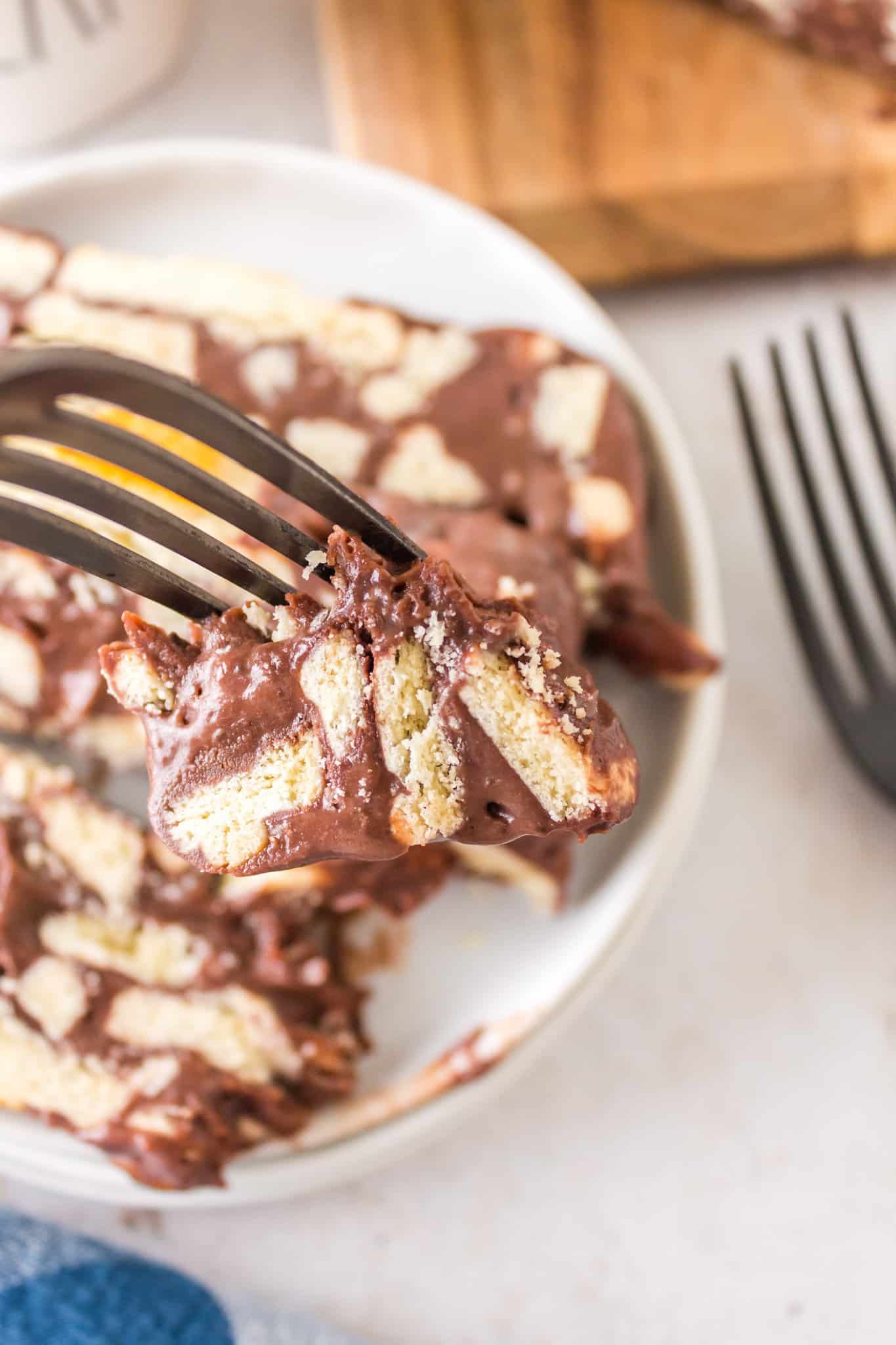 Lazy Cake is an easy no bake dessert recipe using butter cookies, butter, cocoa powder and sweetened condensed milk.