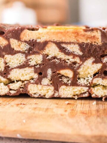 Lazy Cake is an easy no bake dessert recipe using butter cookies, butter, cocoa powder and sweetened condensed milk.