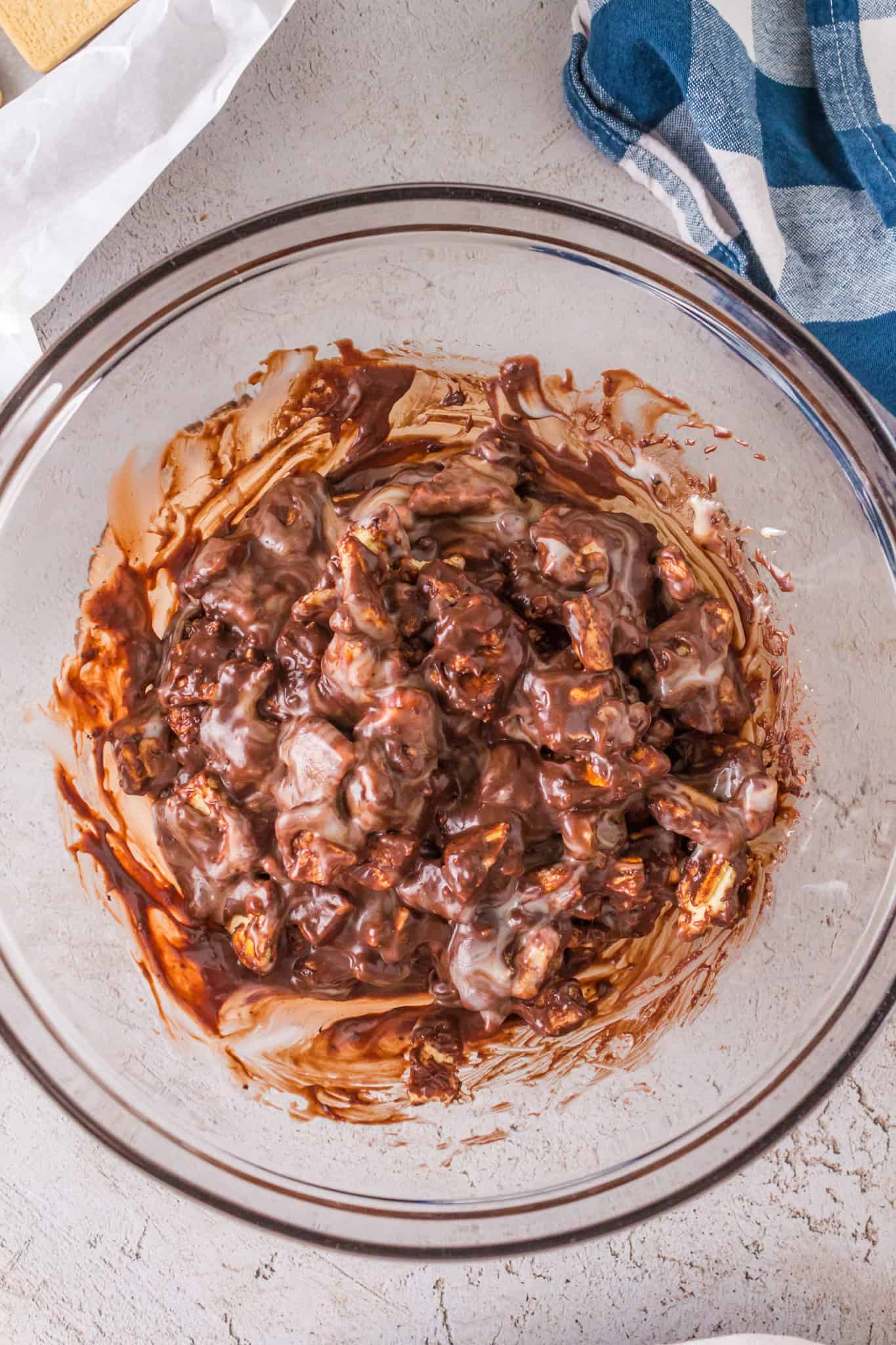 butter cookie pieces coated in chocolate in a mixing bowl