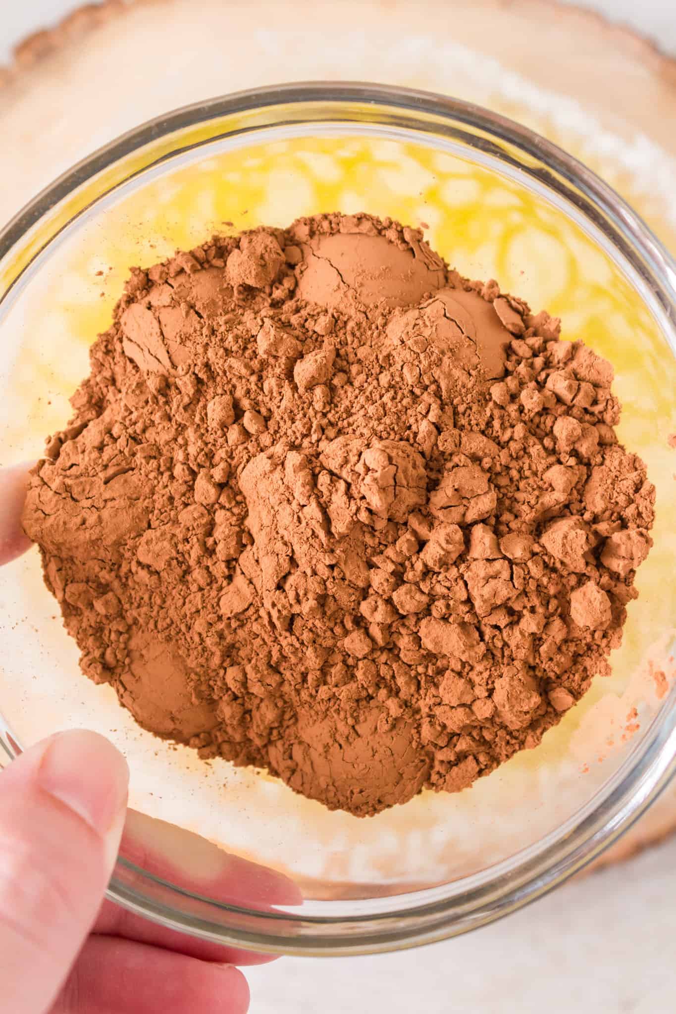 melted butter and cocoa powder in a mixing bowl