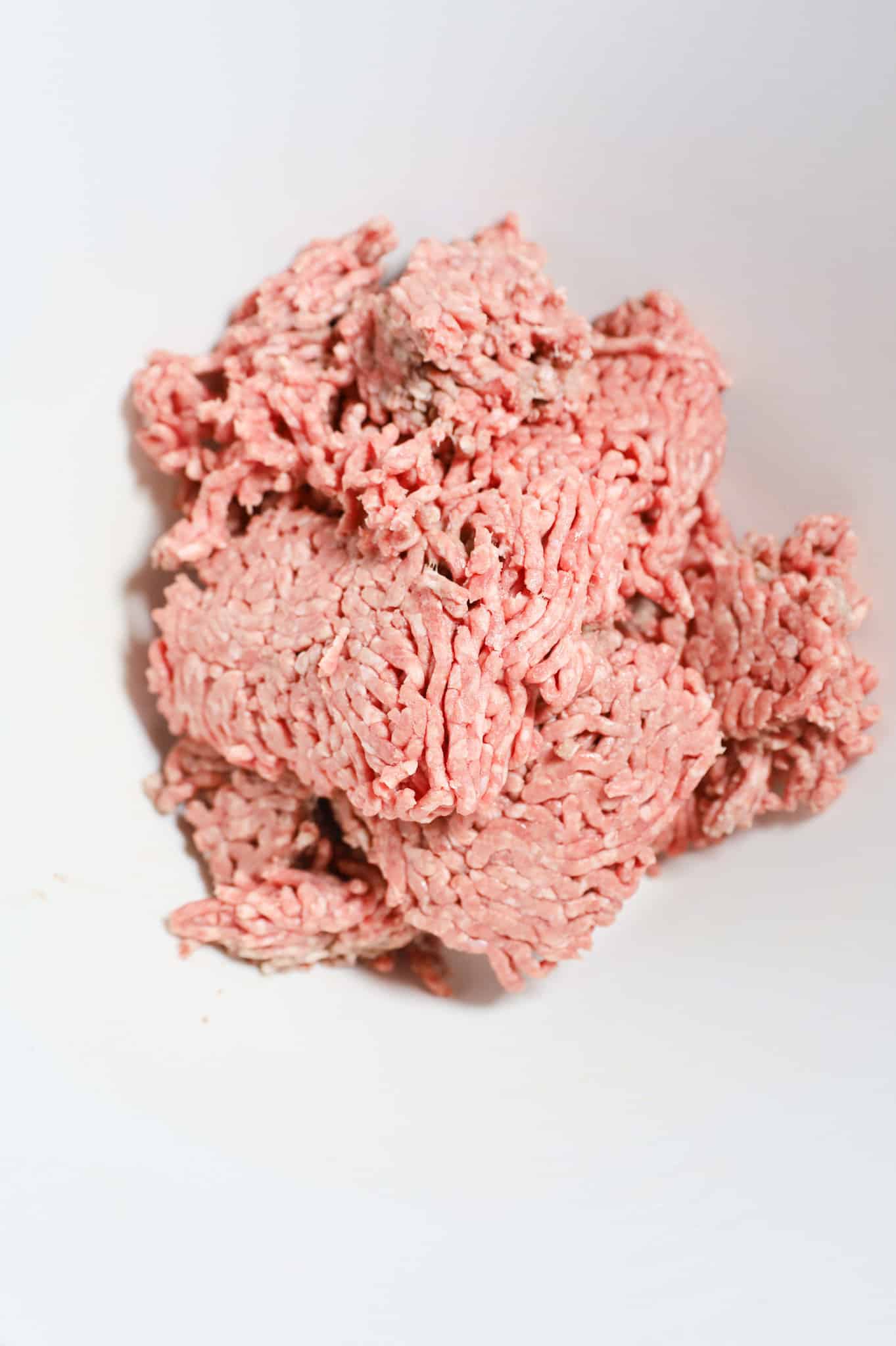 raw ground beef in a mixing bowl