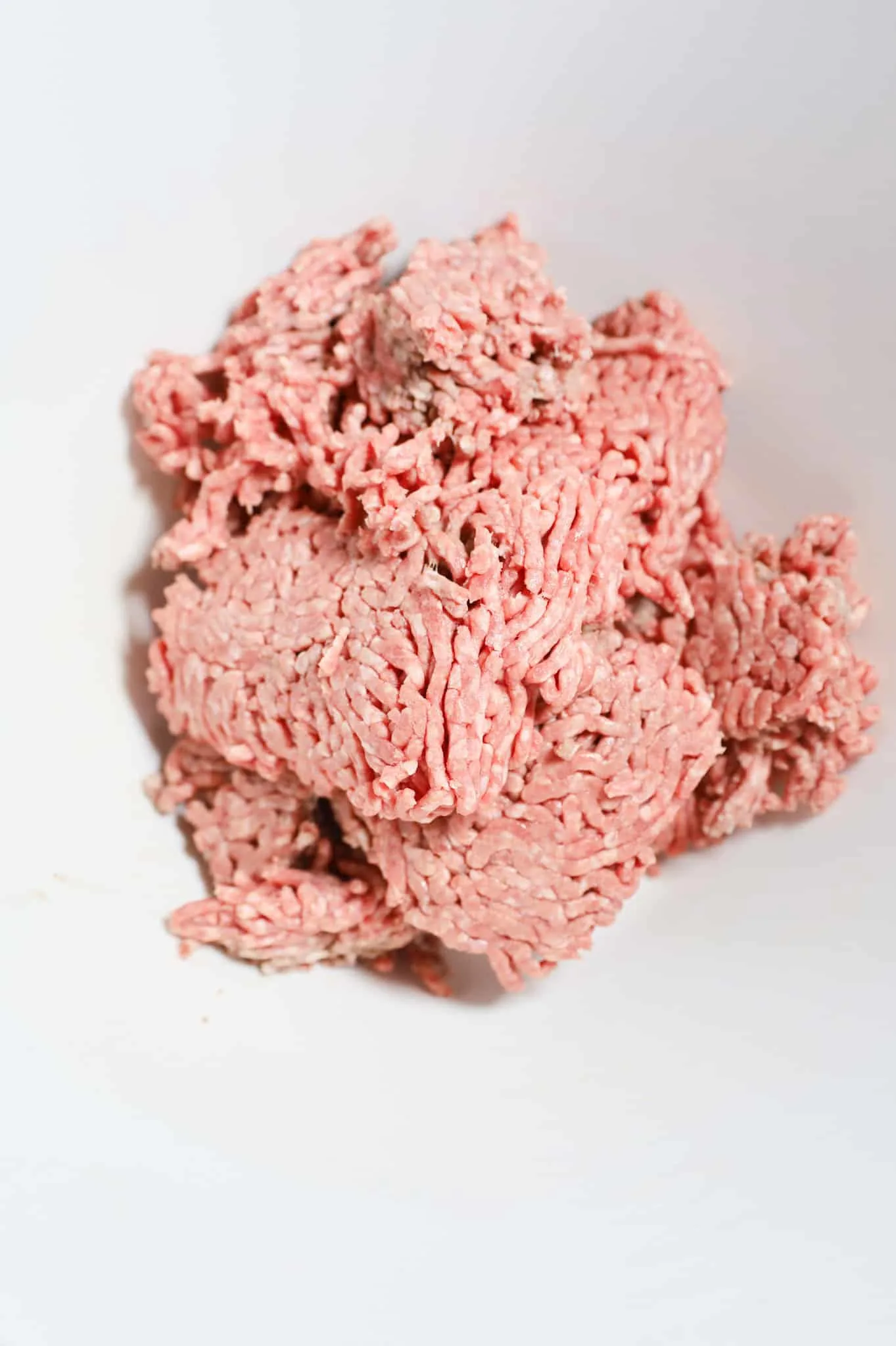 raw ground beef in a mixing bowl