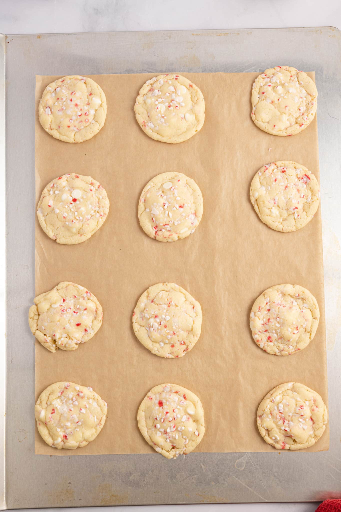 peppermint cookies on a parchment lined baking sheet