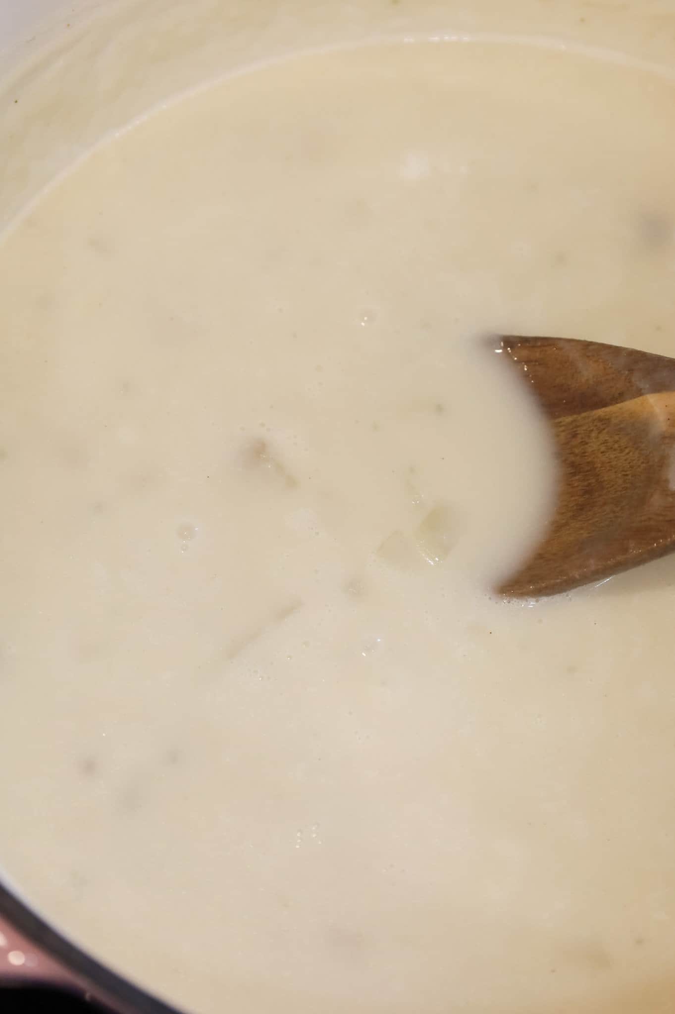 simmering potato soup in a pot