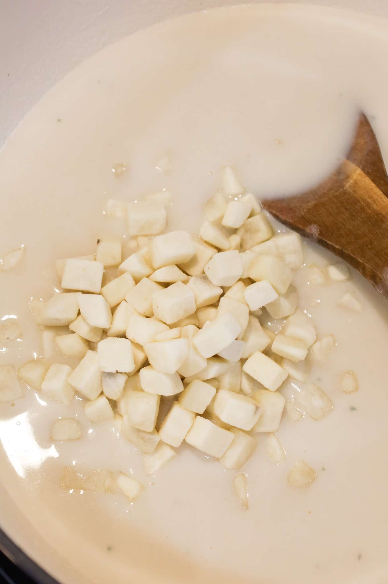 frozen diced hashbrown potatoes added to pot with milk, broth and instant mashed potato mixture