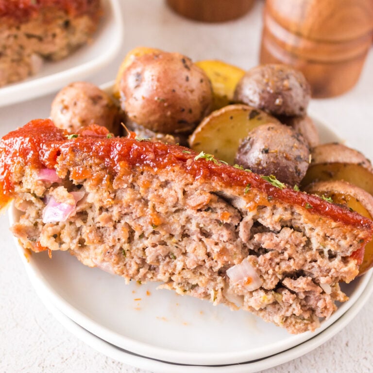 Air Fryer Meatloaf is a simple ground beef meatloaf recipe made with Italian seasoned bread crumbs and topped with a brown sugar ketchup glaze.