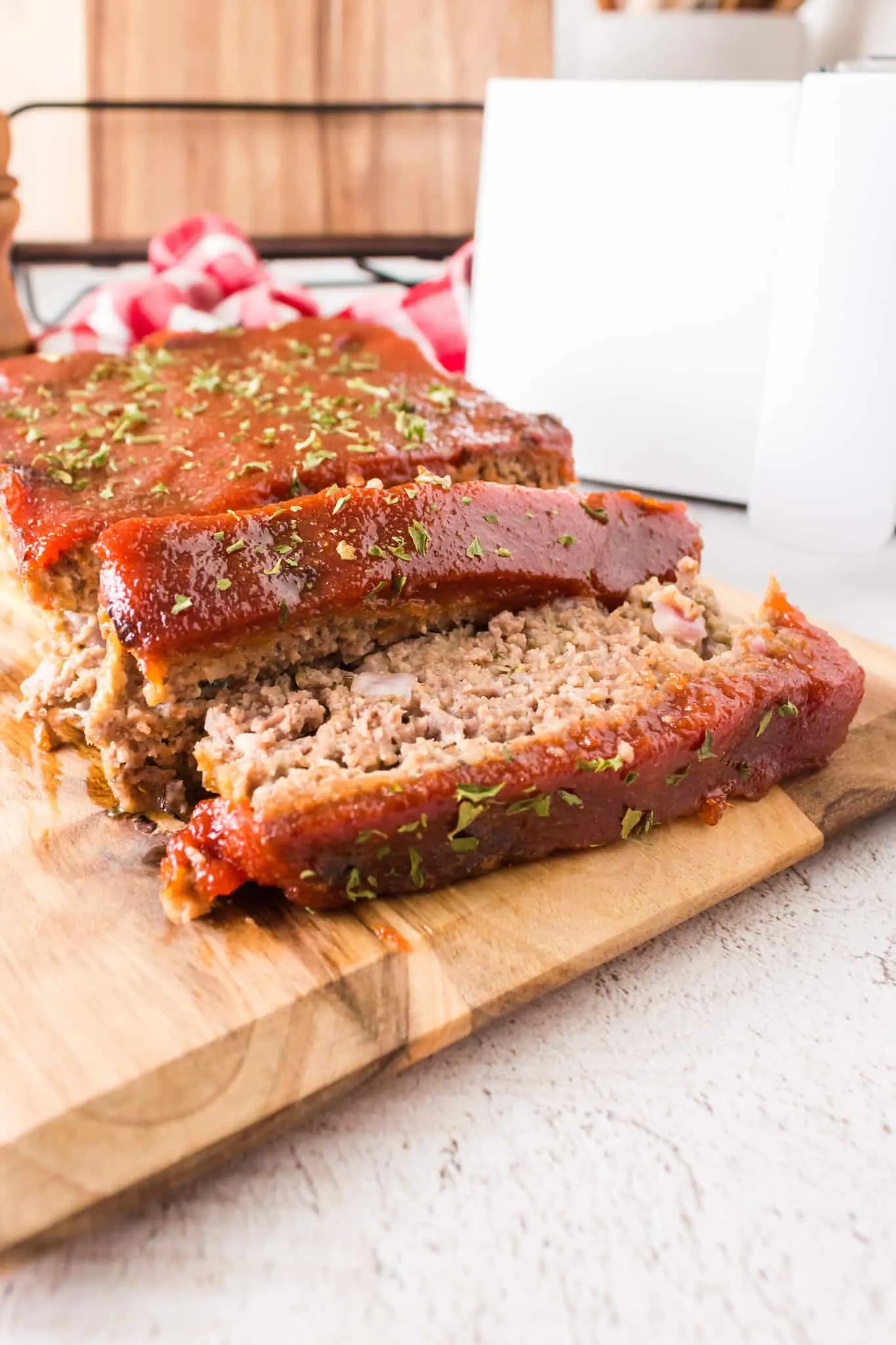 Air Fryer Meatloaf is a simple ground beef meatloaf recipe made with Italian seasoned bread crumbs and topped with a brown sugar ketchup glaze.