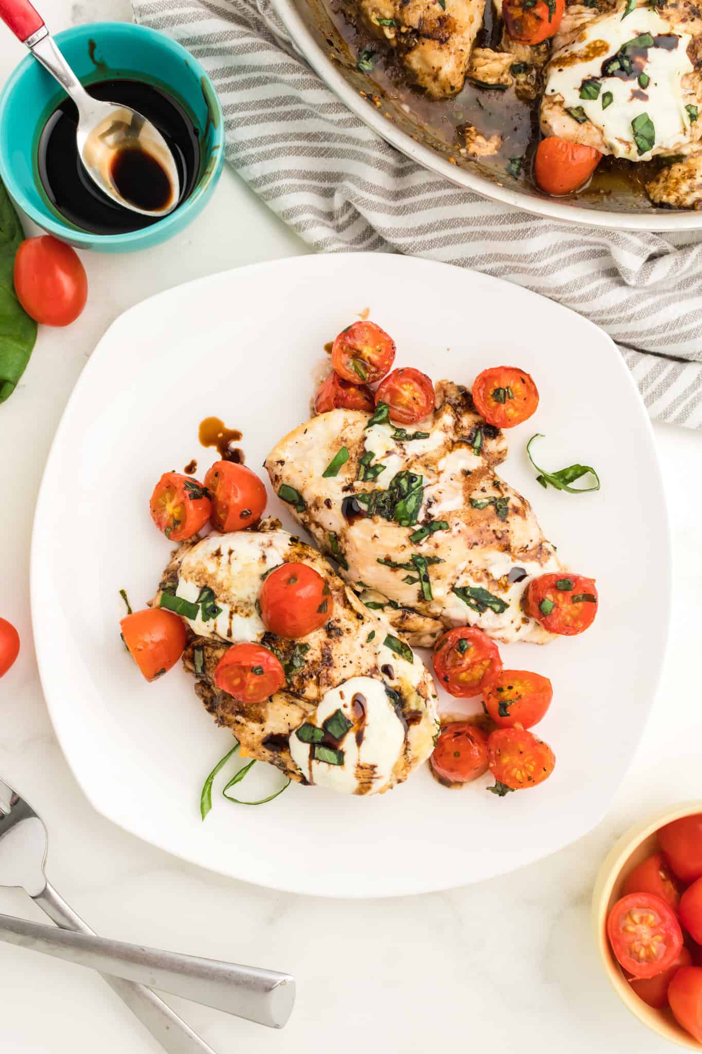 Caprese Chicken is a delicious chicken dish loaded with cherry tomatoes, fresh mozzarella, basil and balsamic vinaigrette.