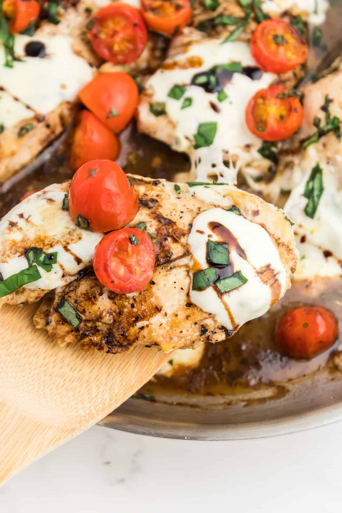 Caprese Chicken is a delicious chicken dish loaded with cherry tomatoes, fresh mozzarella, basil and balsamic vinaigrette.