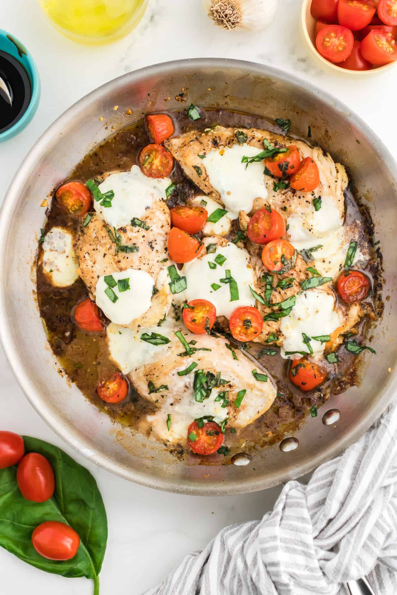 Caprese Chicken is a delicious chicken dish loaded with cherry tomatoes, fresh mozzarella, basil and balsamic vinaigrette.