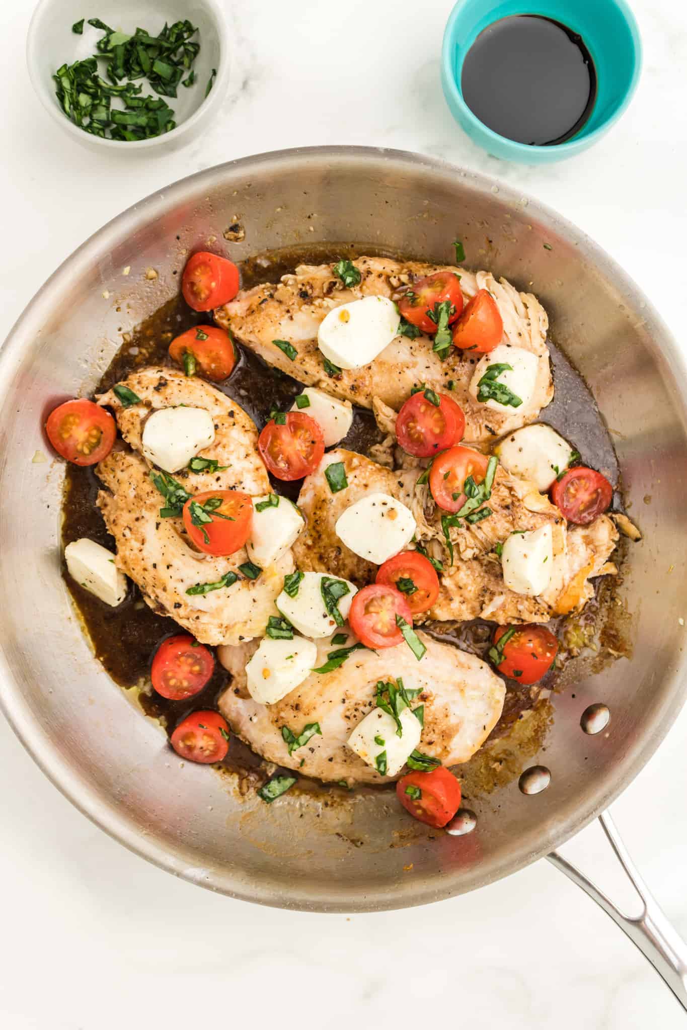 Caprese Chicken is a delicious chicken dish loaded with cherry tomatoes, fresh mozzarella, basil and balsamic vinaigrette.