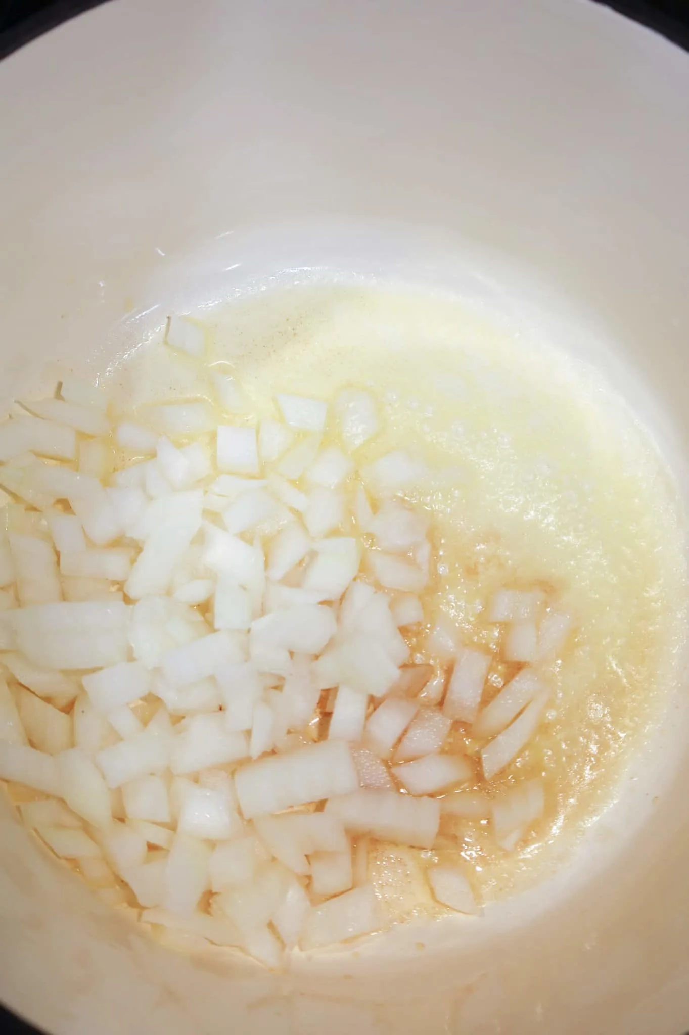 diced onions added to pot with melted butter