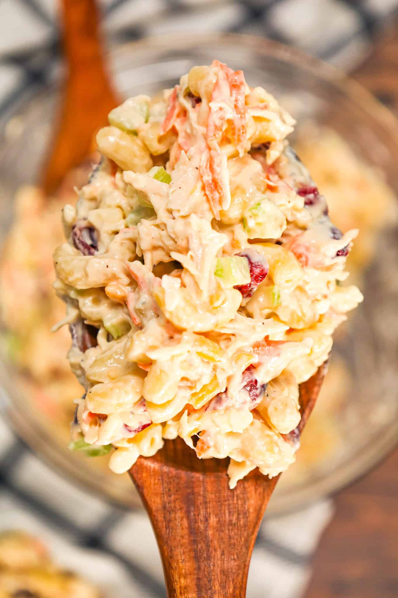 Chicken Macaroni Salad is a tasty pasta salad recipe loaded with carrots, onions, celery, mayo, chopped chicken, dried cranberries and shredded cheddar cheese.