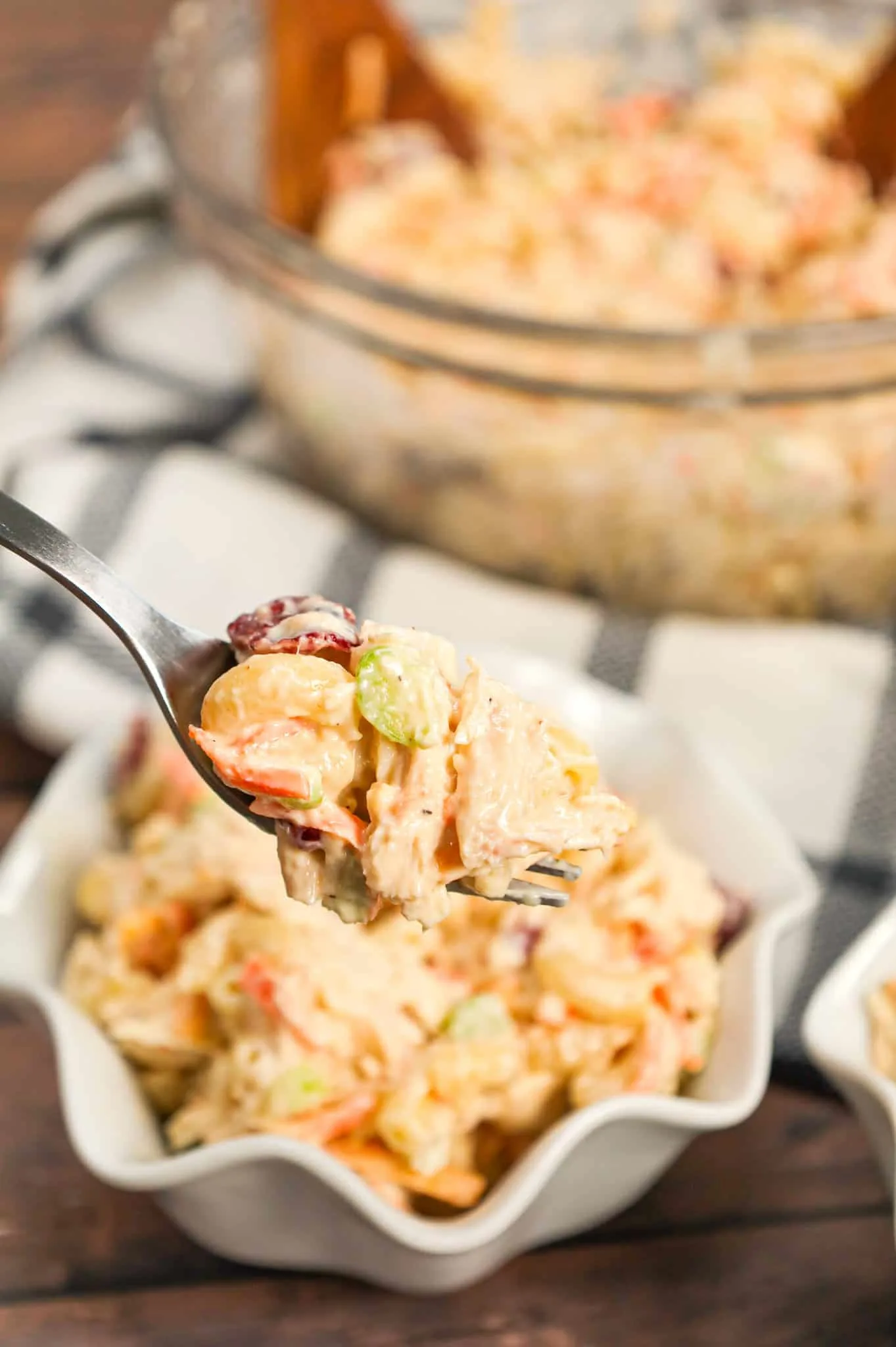 Chicken Macaroni Salad is a tasty pasta salad recipe loaded with carrots, onions, celery, mayo, chopped chicken, dried cranberries and shredded cheddar cheese.
