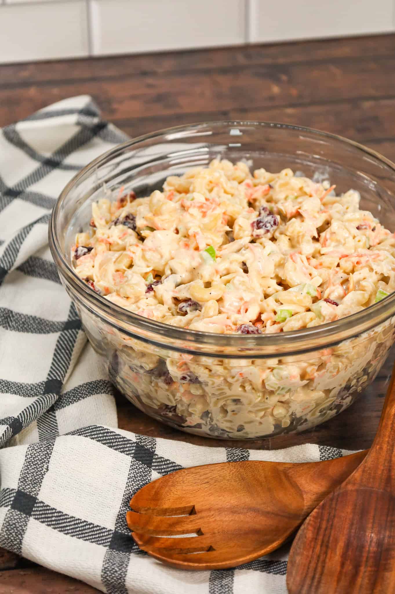 Chicken Macaroni Salad is a tasty pasta salad recipe loaded with carrots, onions, celery, mayo, chopped chicken, dried cranberries and shredded cheddar cheese.