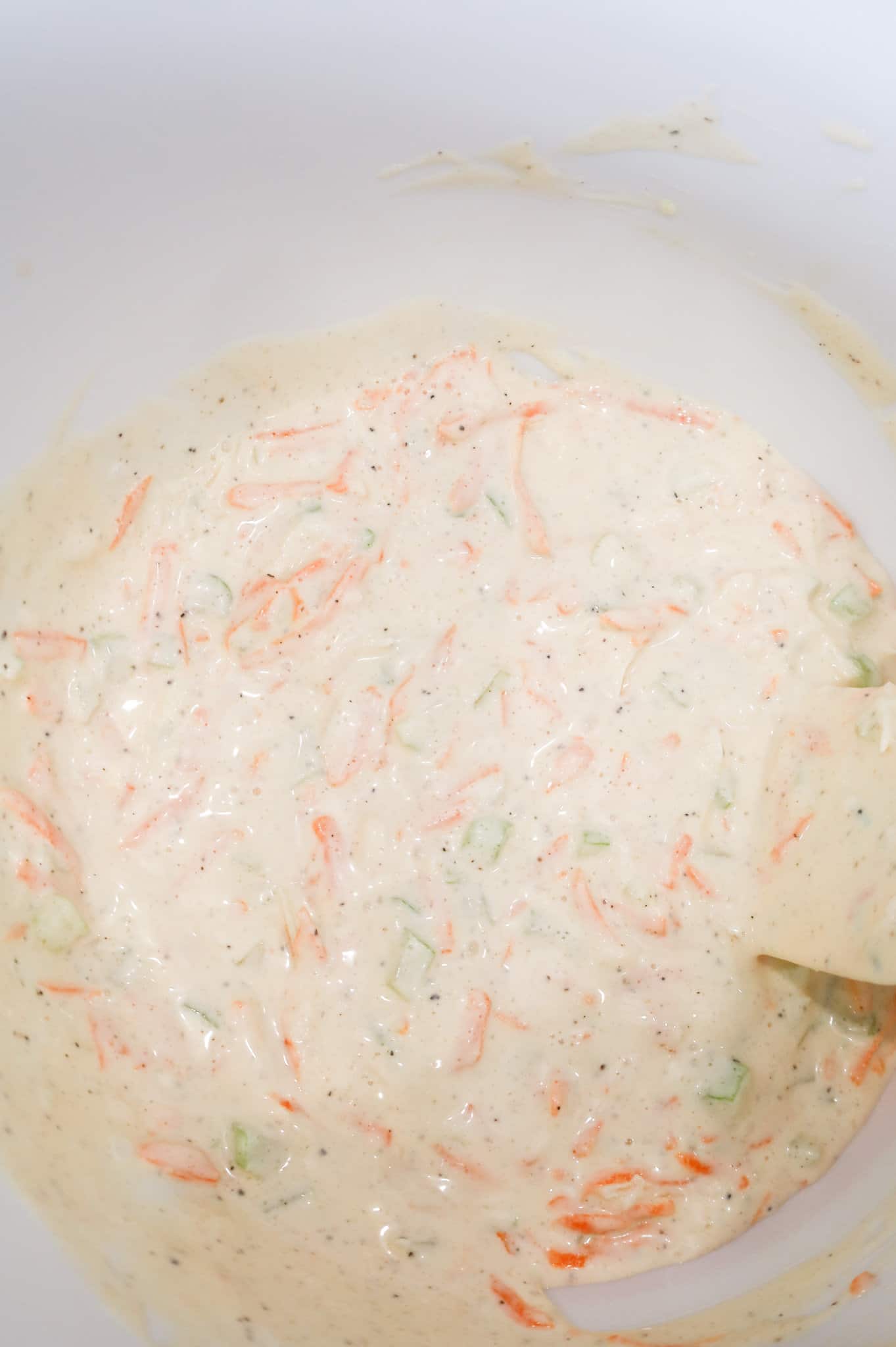 mayo, carrot, onion and celery mixture in a mixing bowl
