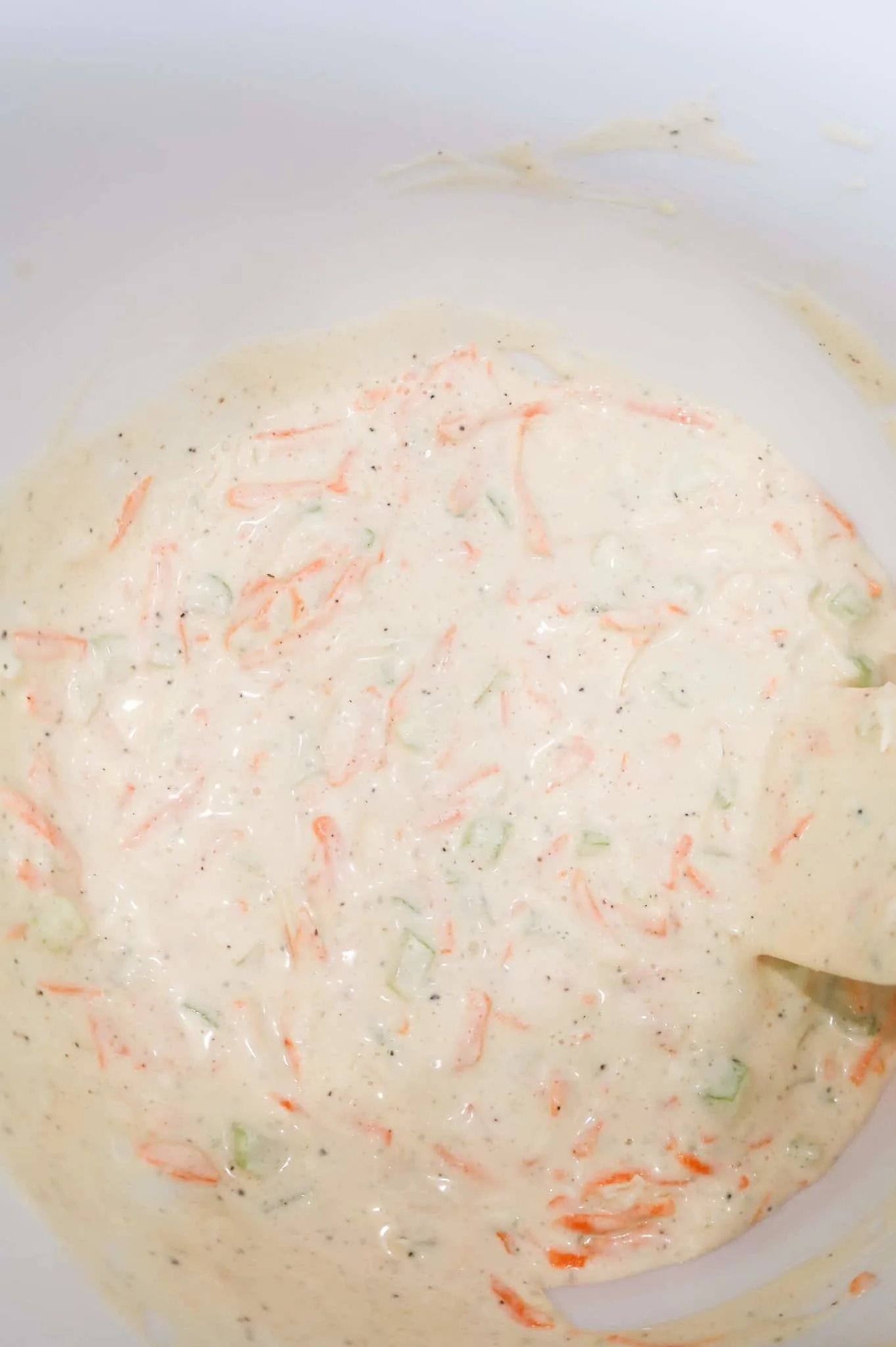mayo, carrot, onion and celery mixture in a mixing bowl
