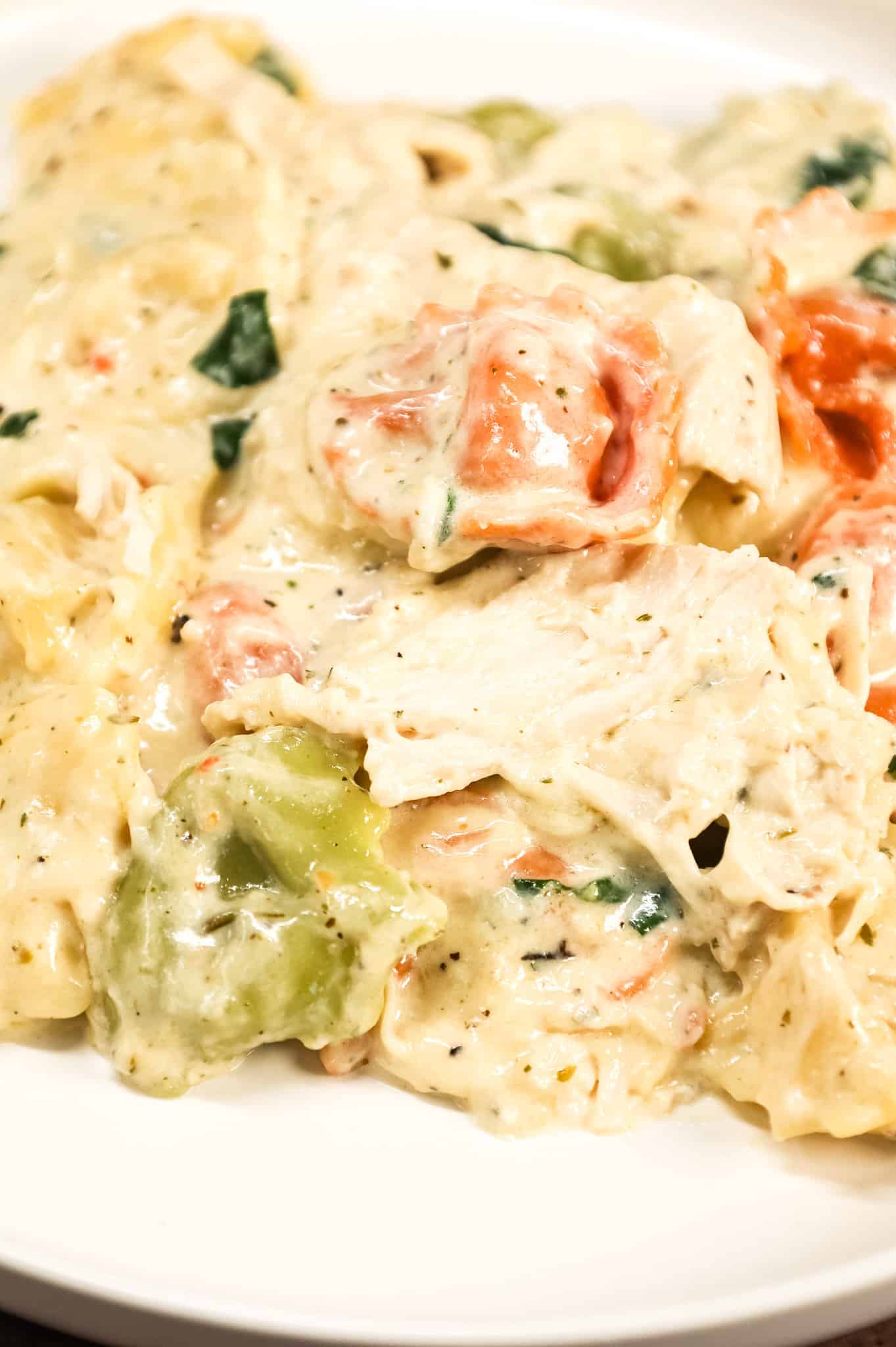 Chicken Tortellini Alfredo is an easy pasta recipe made with store bought cheese tortellini and shredded rotisserie chicken all tossed in a creamy garlic and parmesan sauce.