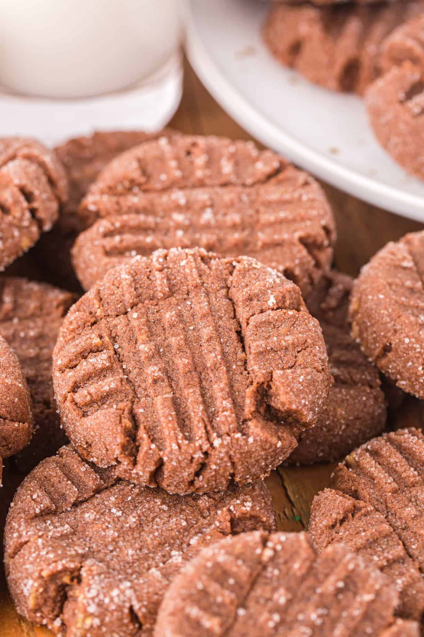 Chocolate Peanut Butter Cookies are a simple and delicious cookie recipe using peanut butter cookie mix, cocoa powder, an egg, butter and topped with a sprinkle of sugar.