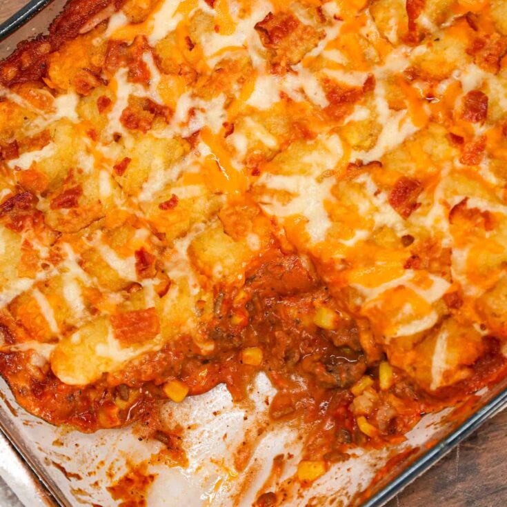 Cowboy Casserole is an easy ground beef casserole recipe loaded with diced tomatoes, corn, tater tots, shredded cheese and bacon.