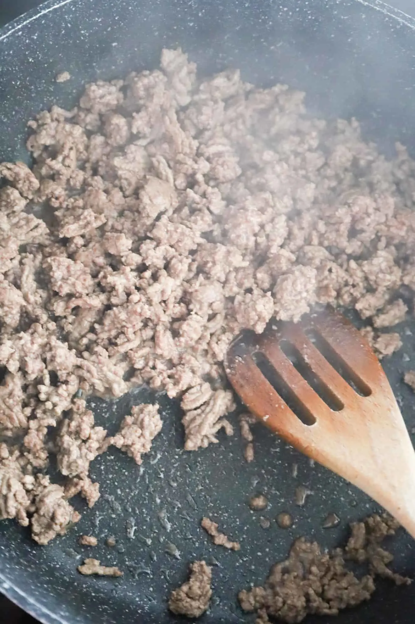 cooked ground beef in a skillet