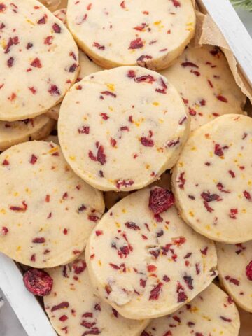 Cranberry Orange Shortbread cookies are delicious melt in your mouth buttery cookies loaded with cranberries and orange zest.