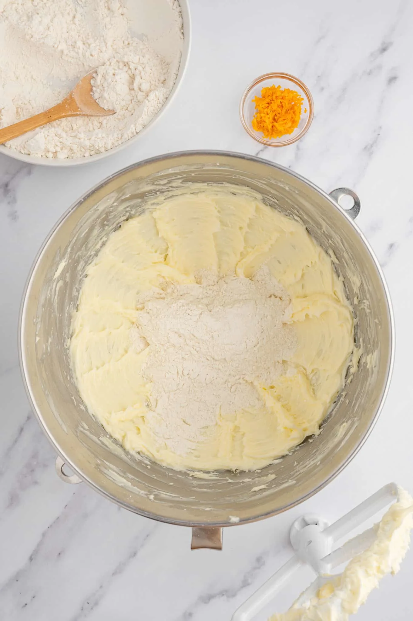 flour added to bowl with creamed butter and confectioner's sugar