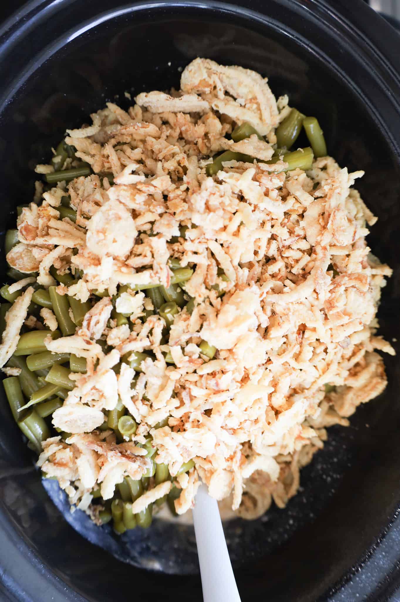 French's crispy fried onions on top of green beans in a slow cooker