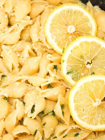Lemon Garlic Pasta is a simple dinner recipe using shell pasta tossed in a lemon garlic butter sauce and topped with grated parmesan and chopped parsley.