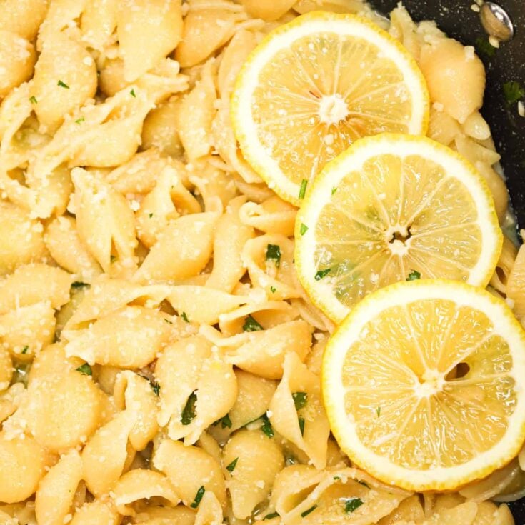 Lemon Garlic Pasta is a simple dinner recipe using shell pasta tossed in a lemon garlic butter sauce and topped with grated parmesan and chopped parsley.