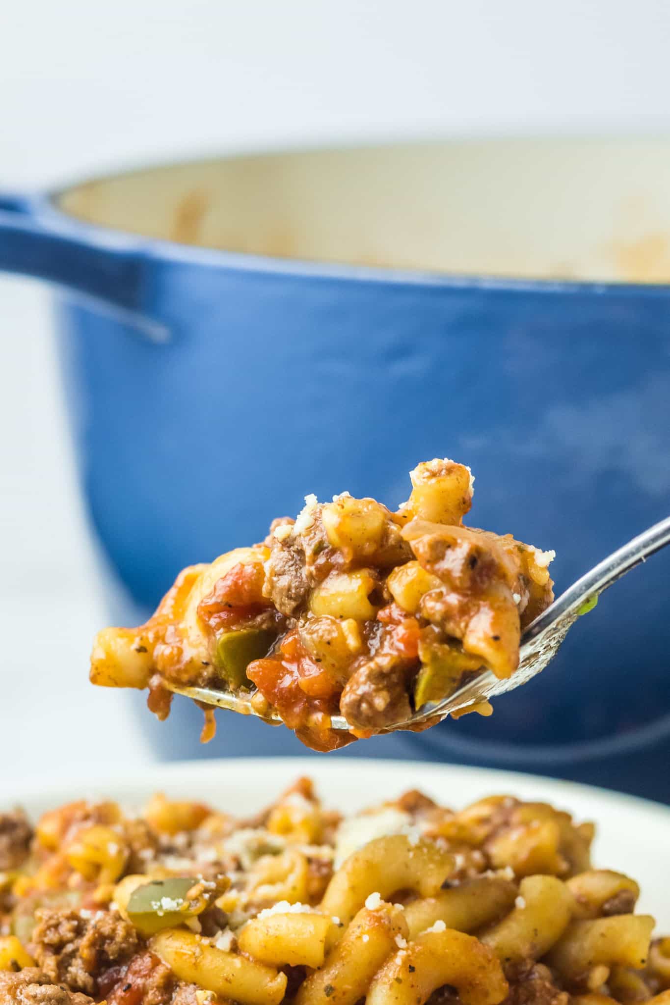 Old Fashioned Goulash is a hearty macaroni recipe loaded with ground beef, diced tomatoes and green peppers all tossed in a tomato sauce seasoned with paprika.