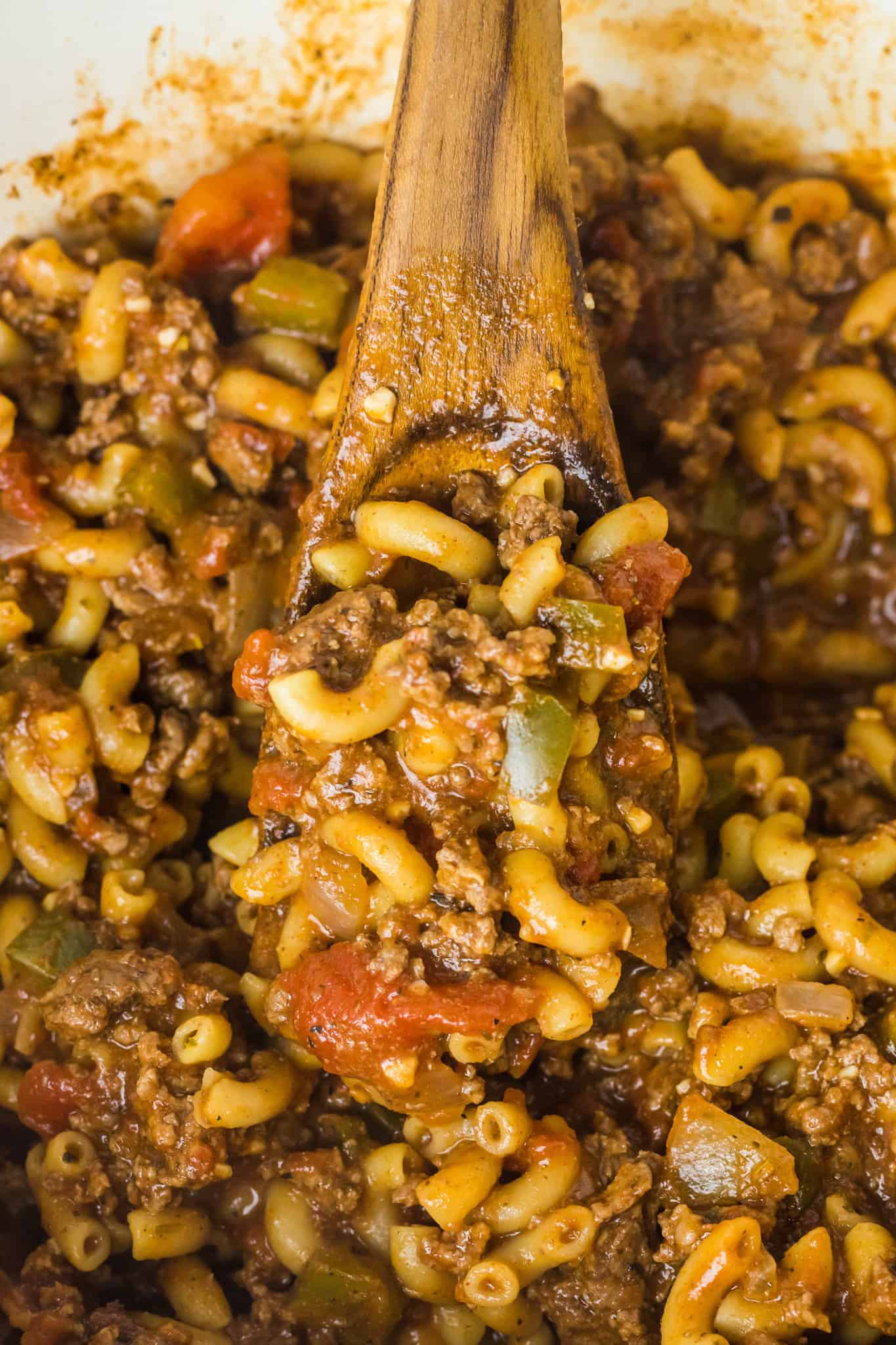 Old Fashioned Goulash is a hearty macaroni recipe loaded with ground beef, diced tomatoes and green peppers all tossed in a tomato sauce seasoned with paprika.