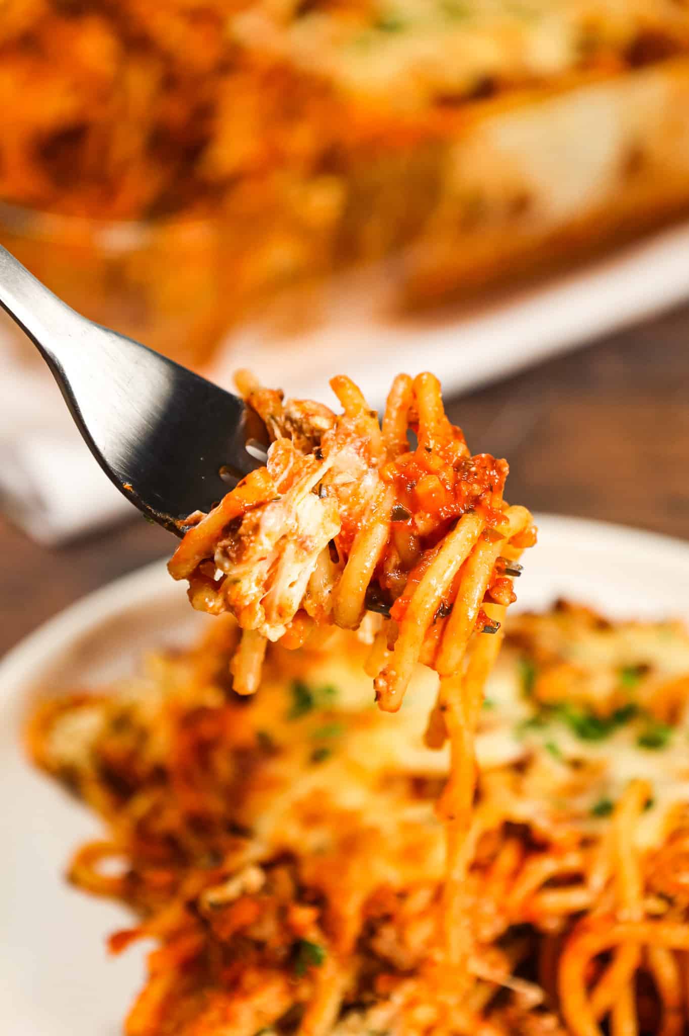 Spaghetti Casserole is a hearty dinner recipe loaded with ground beef, marinara, ricotta, sour cream, mozzarella and parmesan cheese.