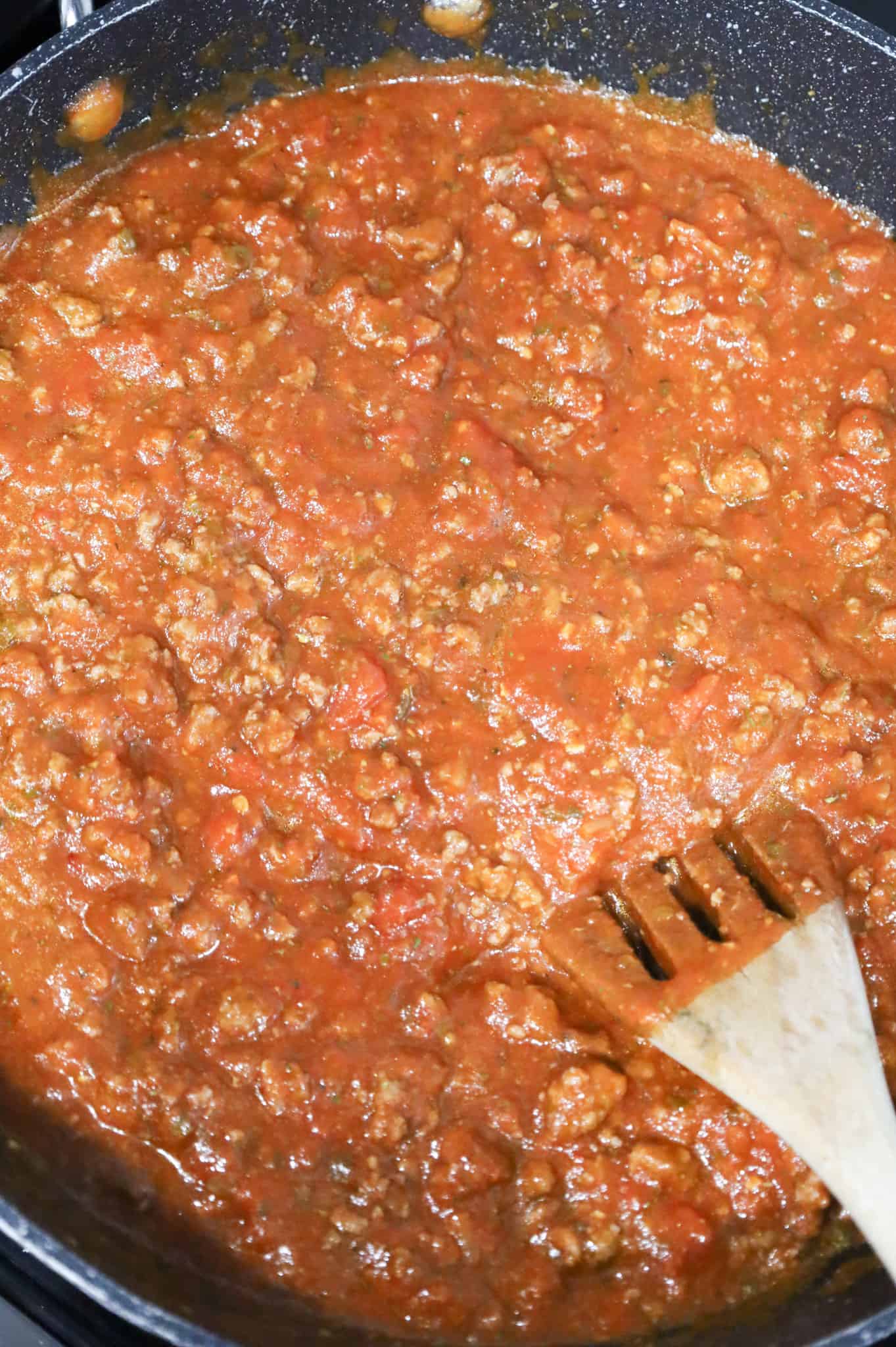 grpund beef and marinara mixture in a saute pan