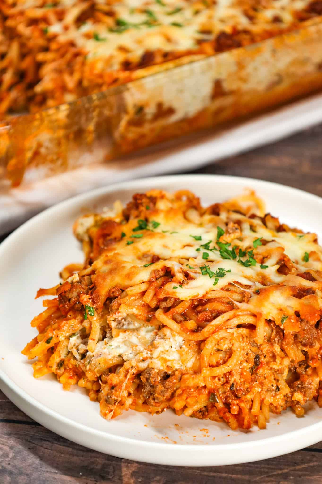 Spaghetti Casserole is a hearty dinner recipe loaded with ground beef, marinara, ricotta, sour cream, mozzarella and parmesan cheese.