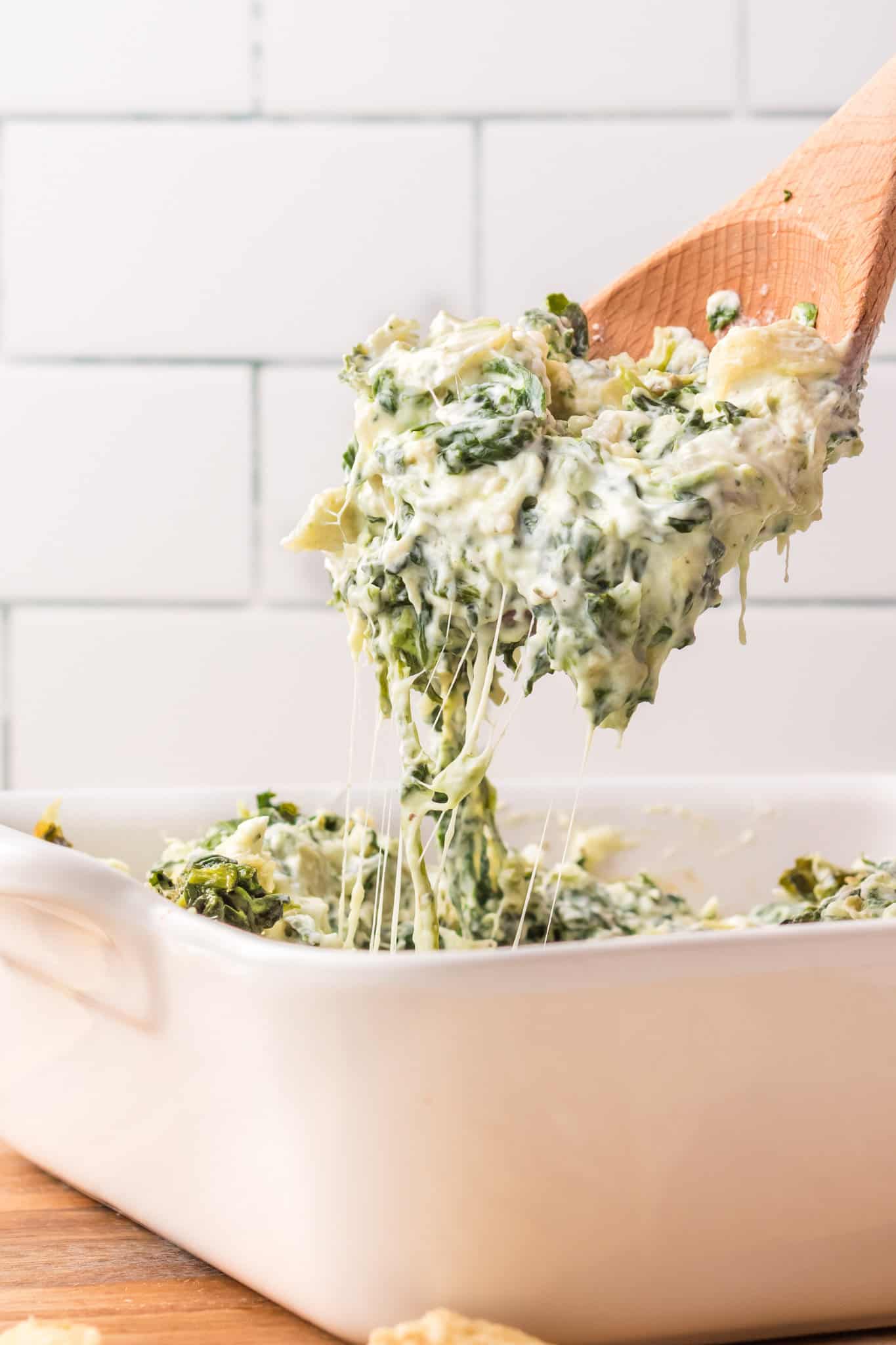 Spinach Artichoke Dip is a creamy baked dip recipe loaded with chopped artichoke hearts, spinach, cream cheese, parmesan and mozzarella.