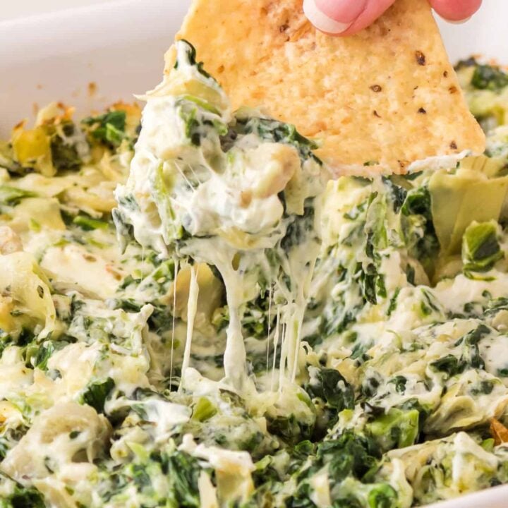 Spinach Artichoke Dip is a creamy baked dip recipe loaded with chopped artichoke hearts, spinach, cream cheese, parmesan and mozzarella.