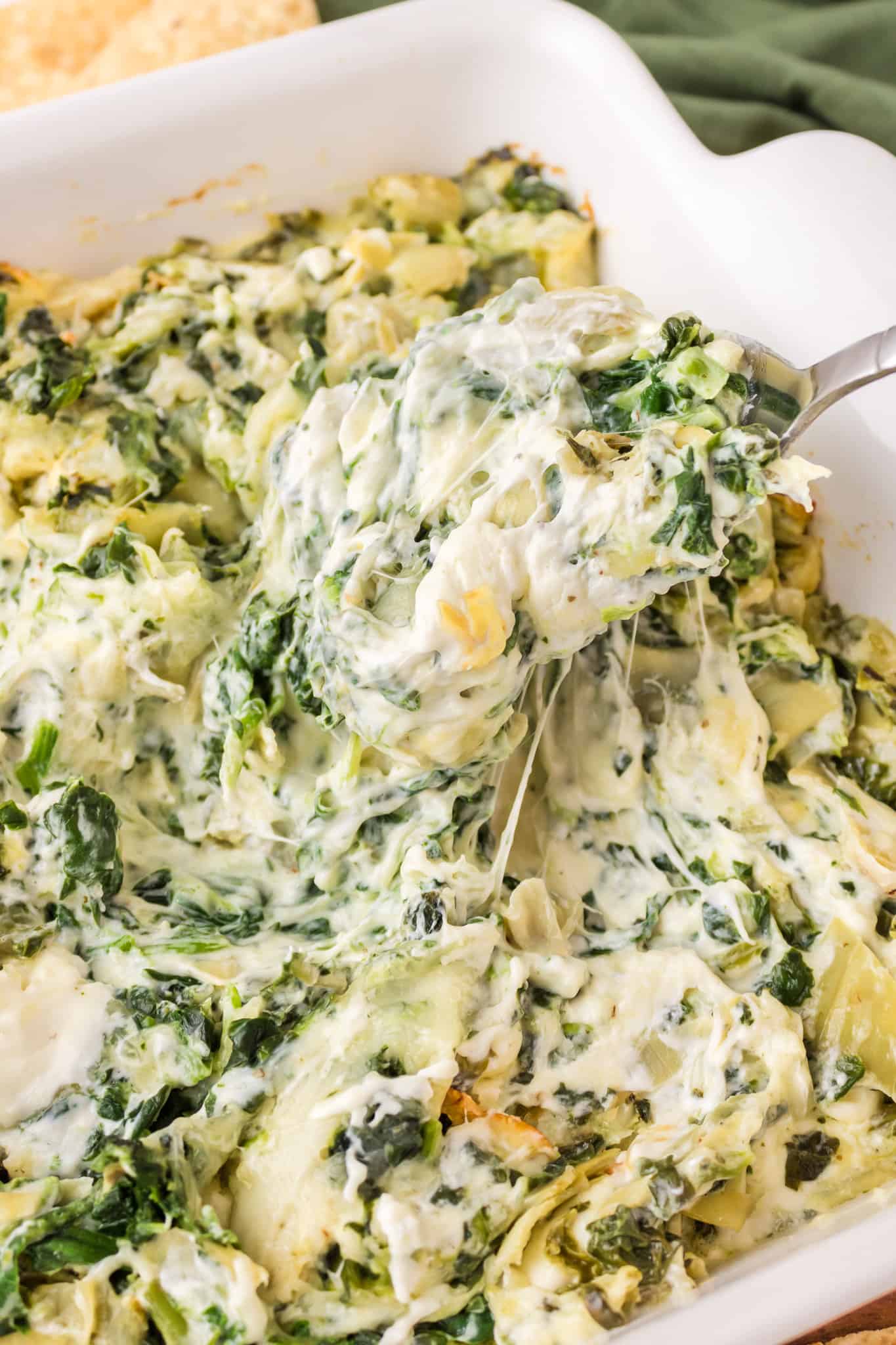 Spinach Artichoke Dip is a creamy baked dip recipe loaded with chopped artichoke hearts, spinach, cream cheese, parmesan and mozzarella.