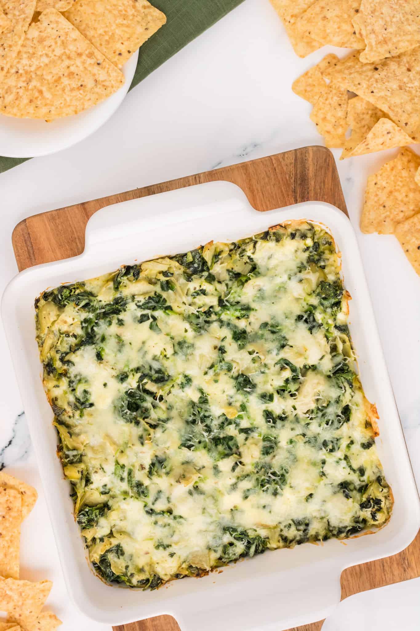 Spinach Artichoke Dip is a creamy baked dip recipe loaded with chopped artichoke hearts, spinach, cream cheese, parmesan and mozzarella.