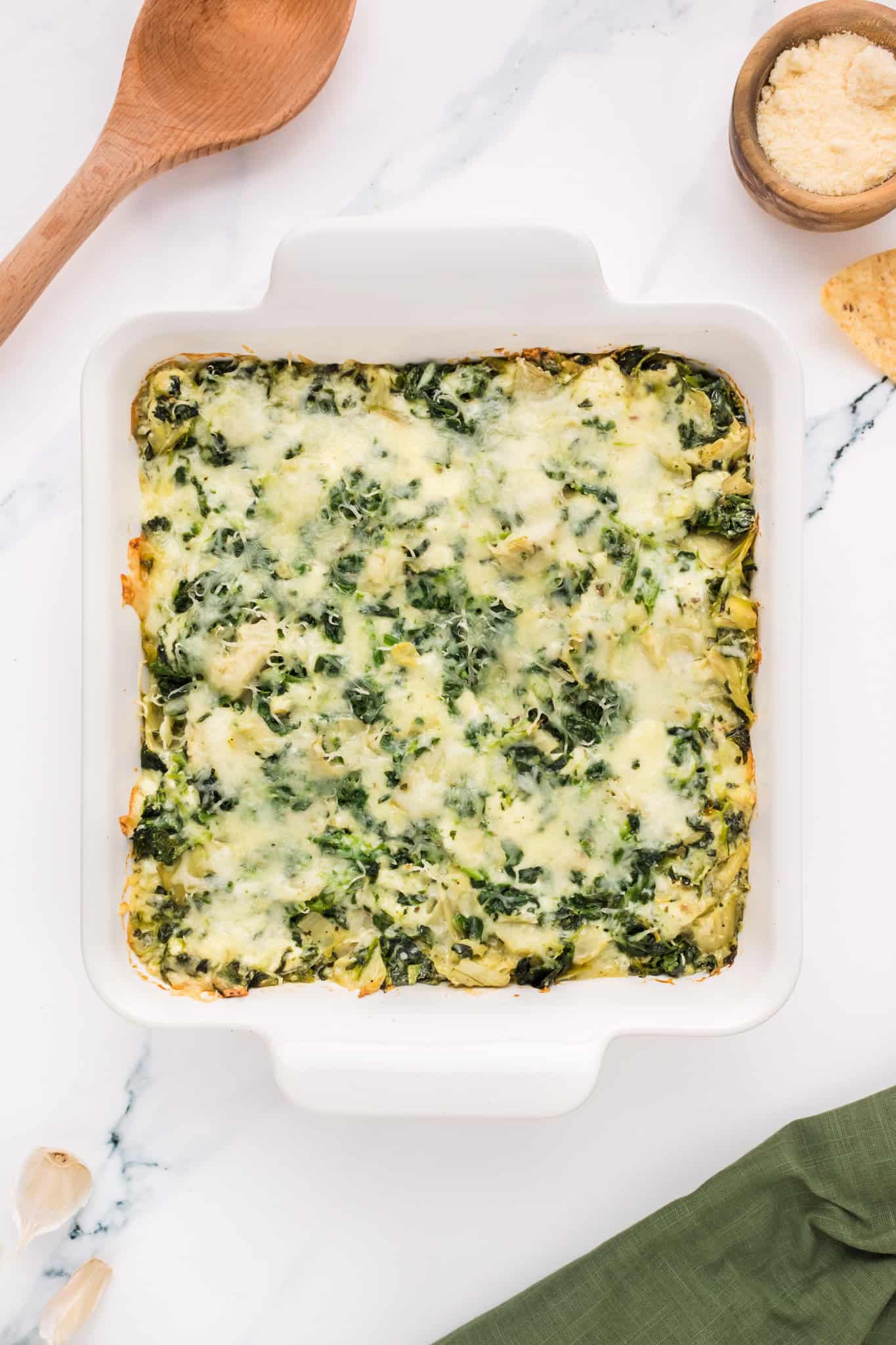 Spinach Artichoke Dip is a creamy baked dip recipe loaded with chopped artichoke hearts, spinach, cream cheese, parmesan and mozzarella.