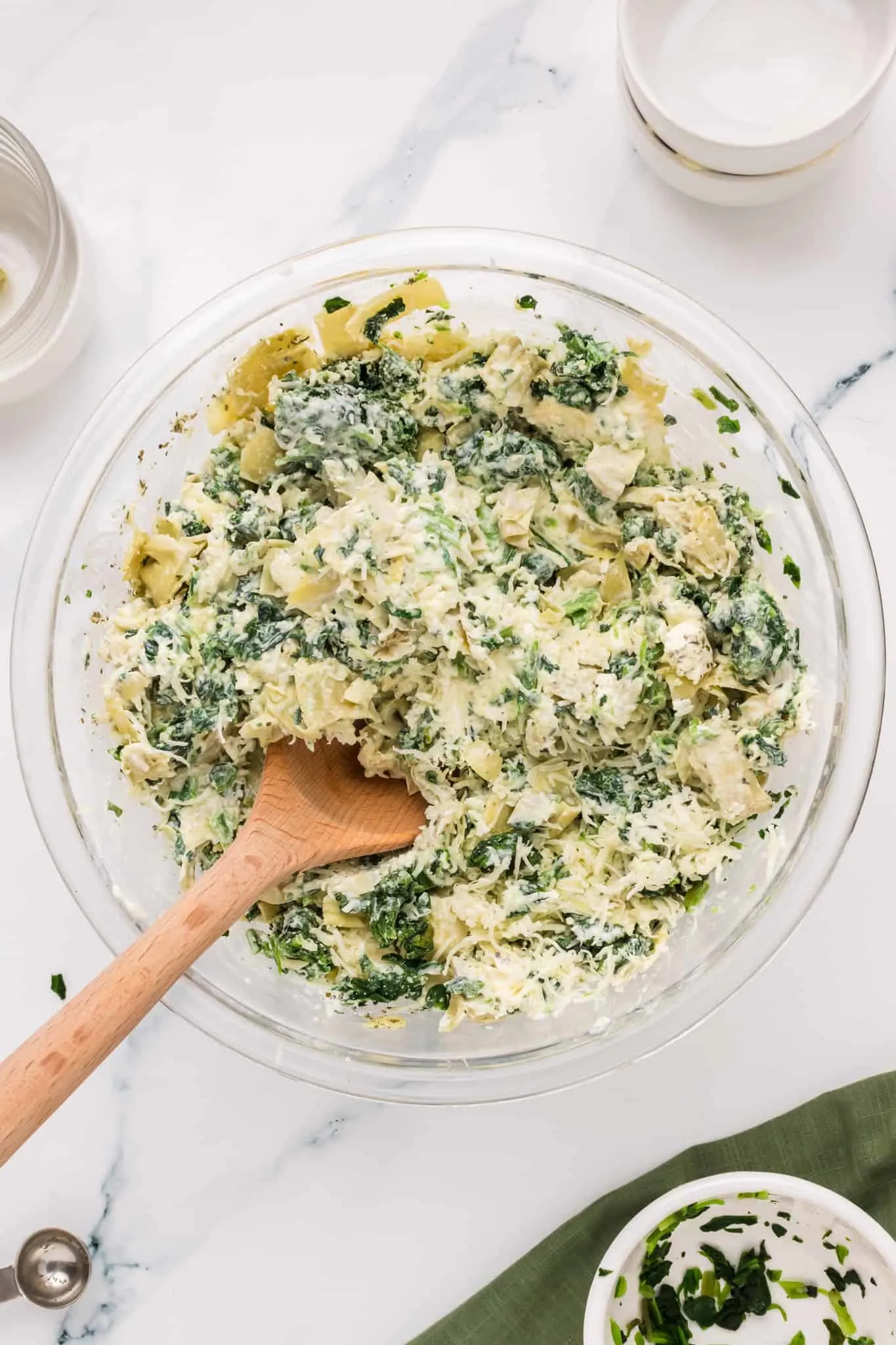 cream cheese, spinach and artichoke mixture in a mixing bowl