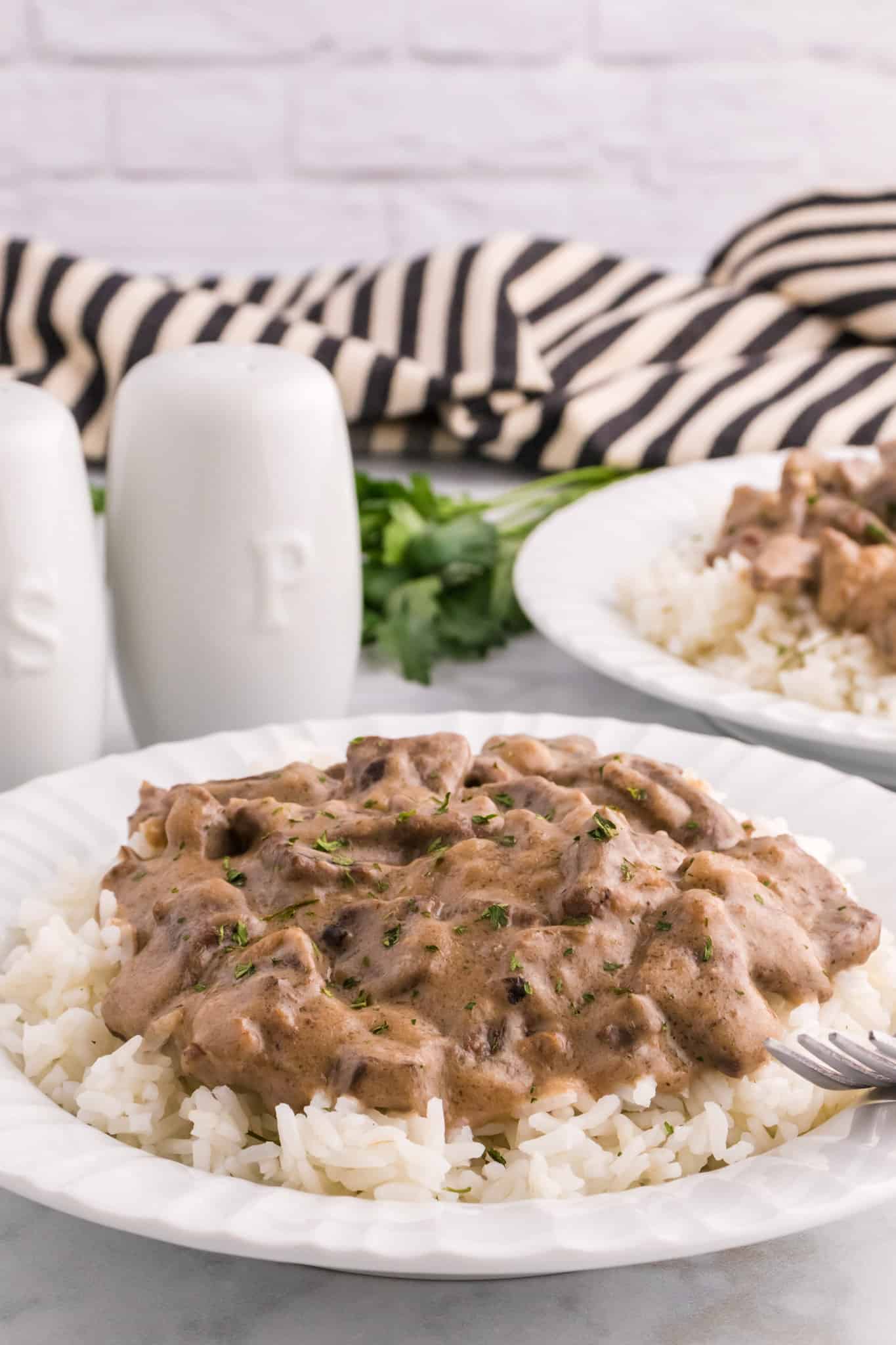 Steak and Rice is a hearty comfort food dish with tender pieces of steak cooked in a creamy mushroom sauce and served over rice.