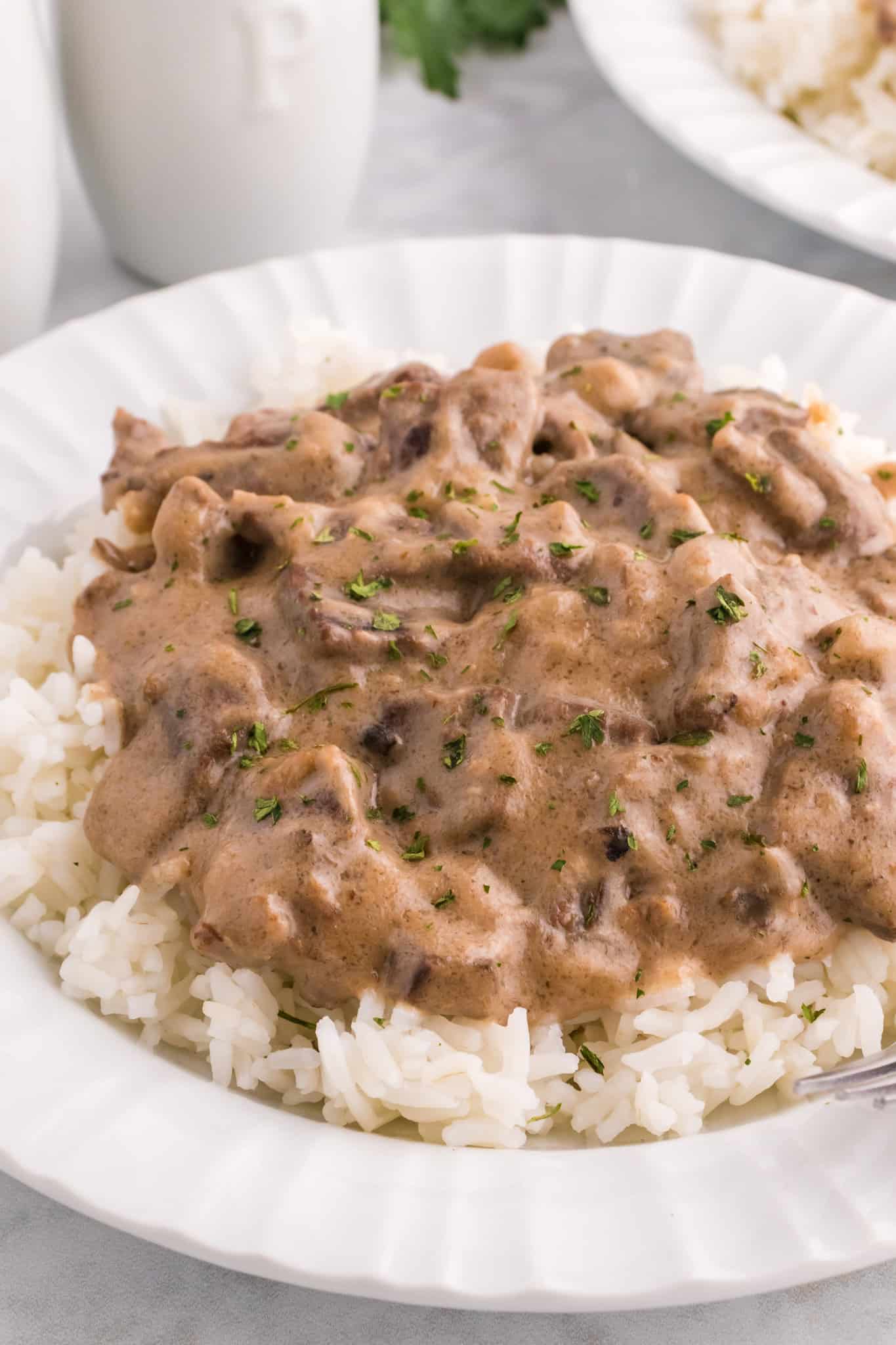 Steak and Rice is a hearty comfort food dish with tender pieces of steak cooked in a creamy mushroom sauce and served over rice.