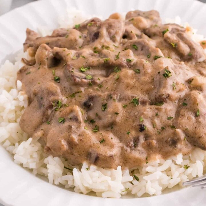 Steak and Rice is a hearty comfort food dish with tender pieces of steak cooked in a creamy mushroom sauce and served over rice.