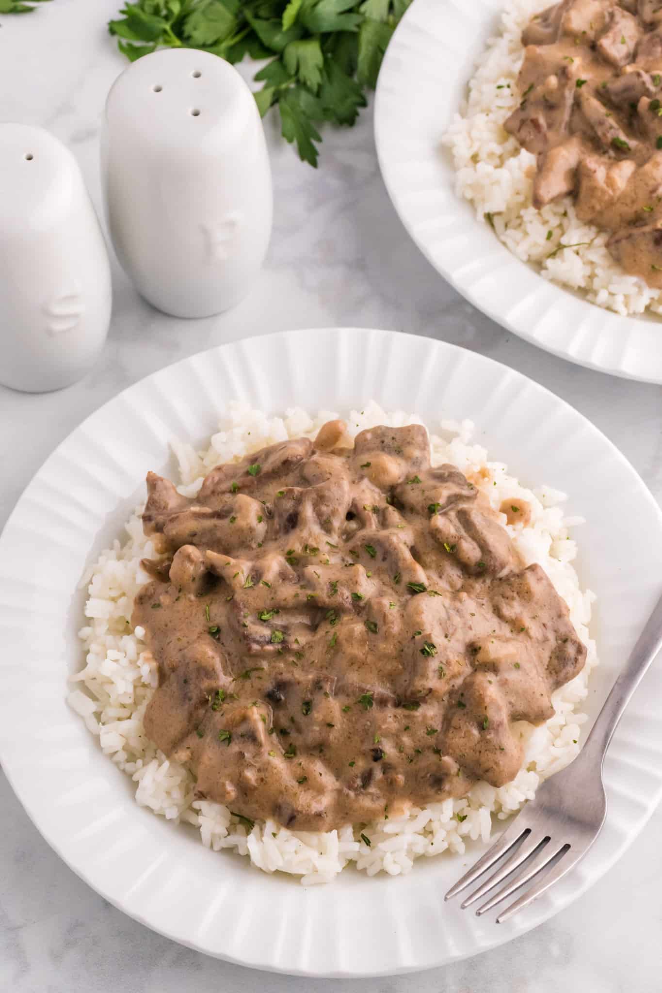 Steak and Rice is a hearty comfort food dish with tender pieces of steak cooked in a creamy mushroom sauce and served over rice.