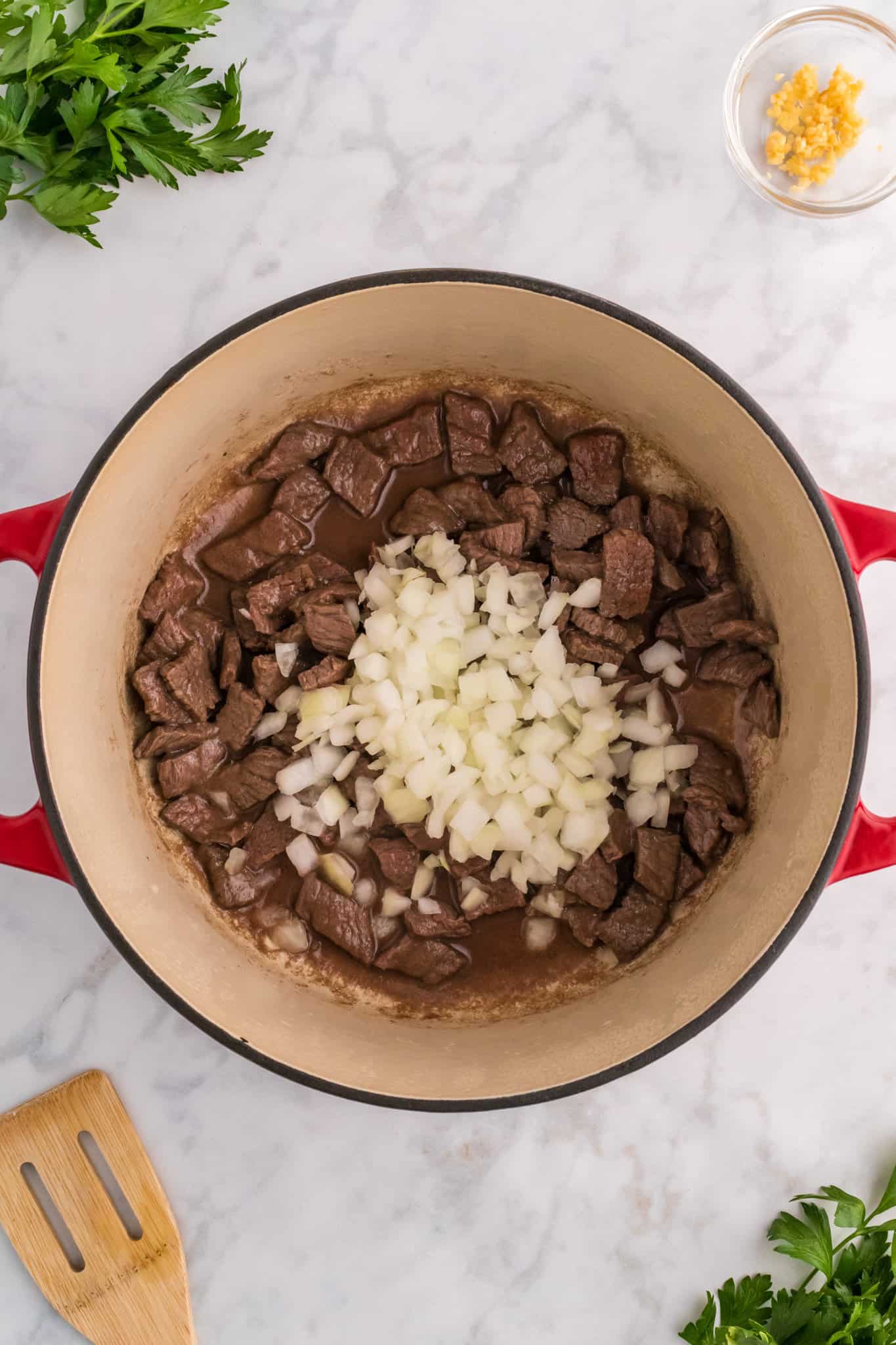 diced onions add to pot with browned steak pieces