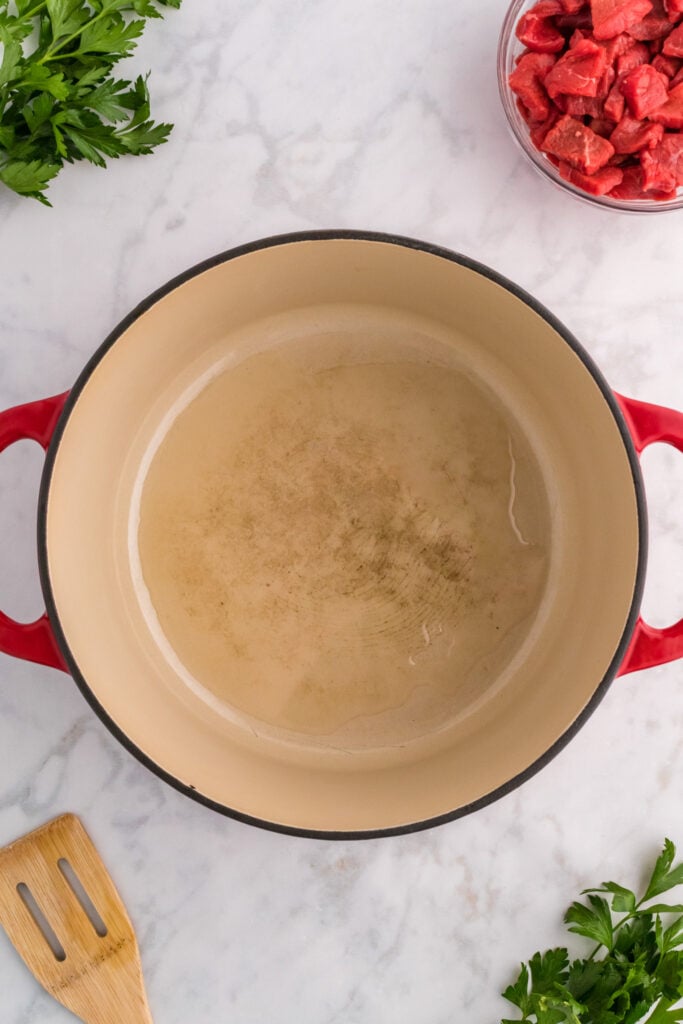 oil heating in the bottom of a dutch oven