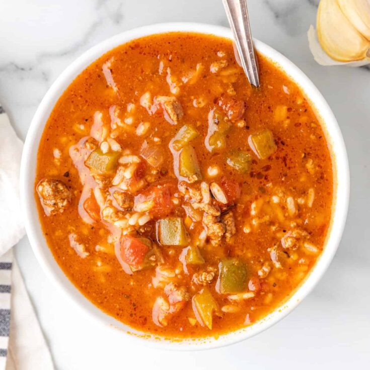 Stuffed Pepper Soup is a hearty soup recipe loaded with ground beef, diced green bell peppers, diced tomatoes and rice.